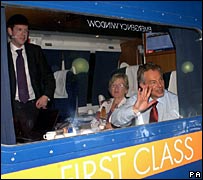 Tony Blair waves from a train