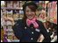 Japanese woman trys on stewardess uniform in a costume shop