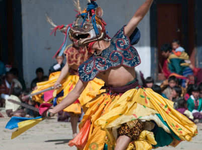 Bhutan traditional dancer with sacred animal face 