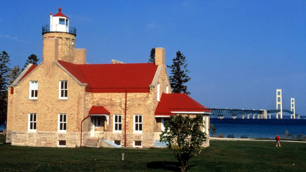 Mackinaw City featuring heritage architecture, a lighthouse and general coastal views