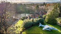 The Arts and Crafts mansion designed by Inigo Triggs with a naturalistic garden by Gertrude Jekyll