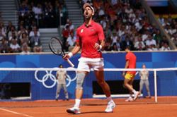 Olympics-Tennis-Djokovic fights off Alcaraz to finally strike gold