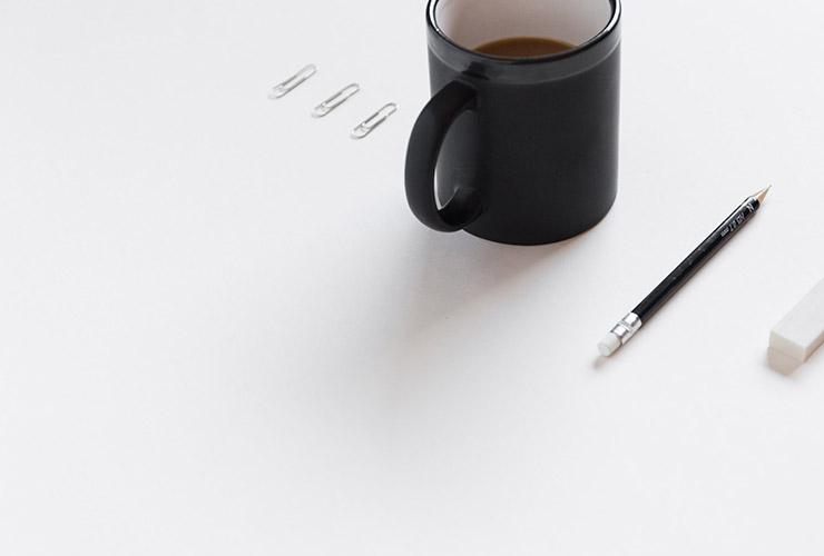 Stop Over-Thinking: 8 Steps To Clear Your Mind by Arslan Hassan. Photograph of a clear paper with a pencil, eraser and paperclips lined up by Bench Accounting