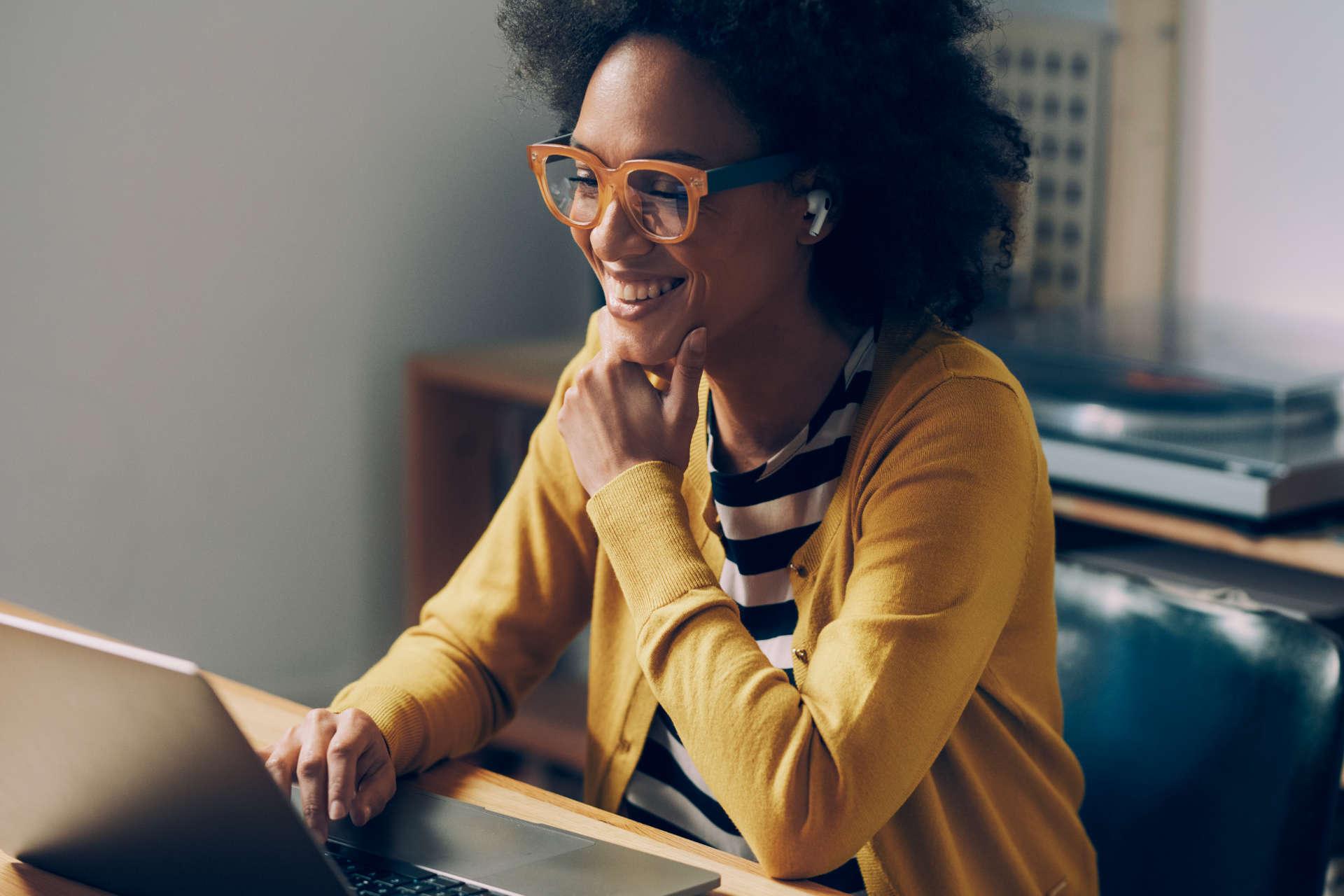 Woman working on laptop from home