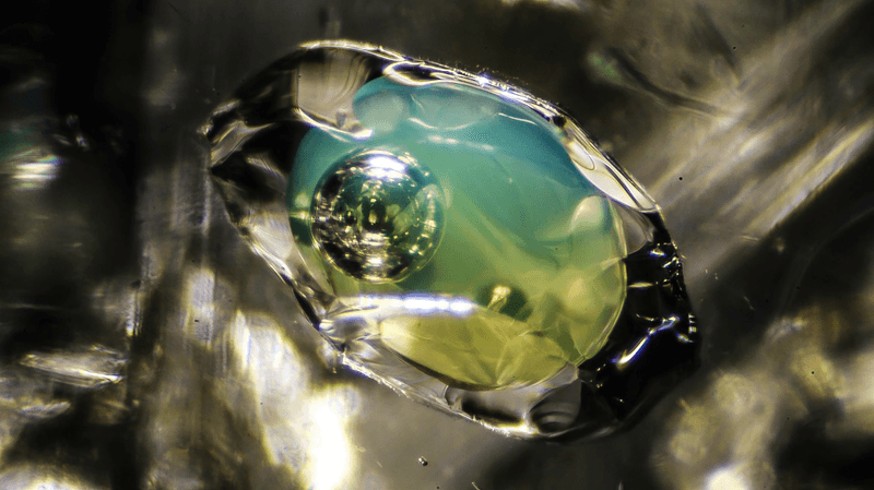 an ancient crystal containing liquid and a bubble