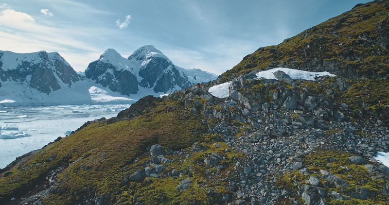 Mountain with rocks, mosses at Antarctic landscape