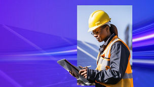 Engineer reading next to solar panel