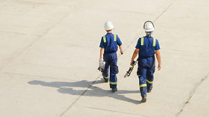 Two engineer walking on the ground