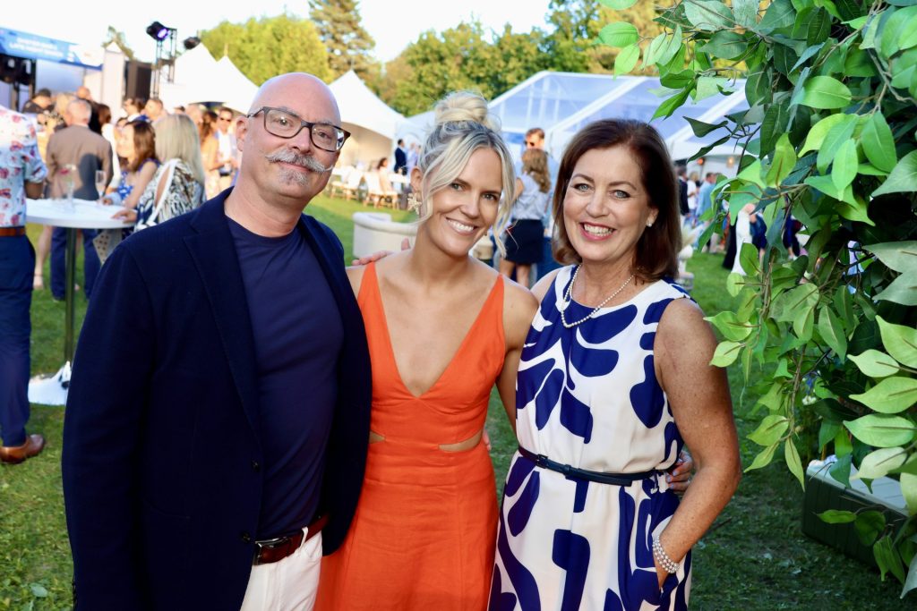 Seaside Soirée Glamping Gala co-chairs Jeff Smith and Michelle Taggart with BGC Ottawa board chair Robyn Osgood, far right, on the Great Lawn outside the Tomlinson Family Foundation Clubhouse on Thursday, August 29, 2024. Photo by Caroline Phillips