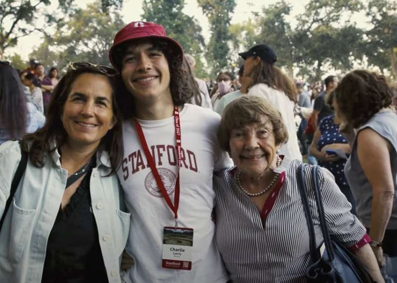 A family smiles at convocation