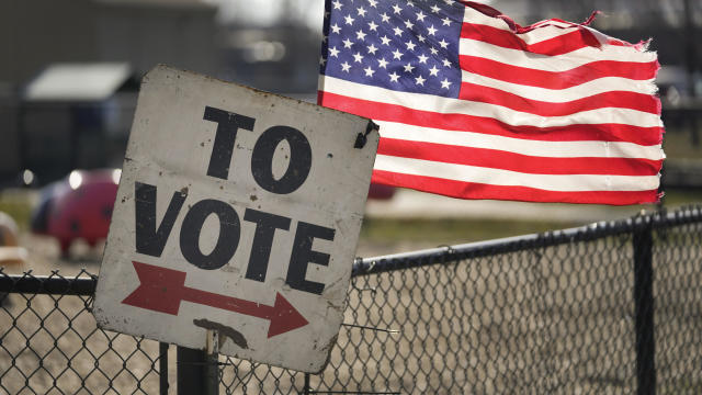 Election 2024 primary voting sign and American flag 