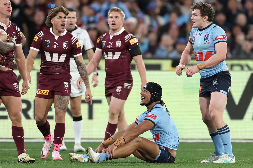 Liam Martin and Stephen Crichton of the NSW Blues shout at Queensland Maroons players.