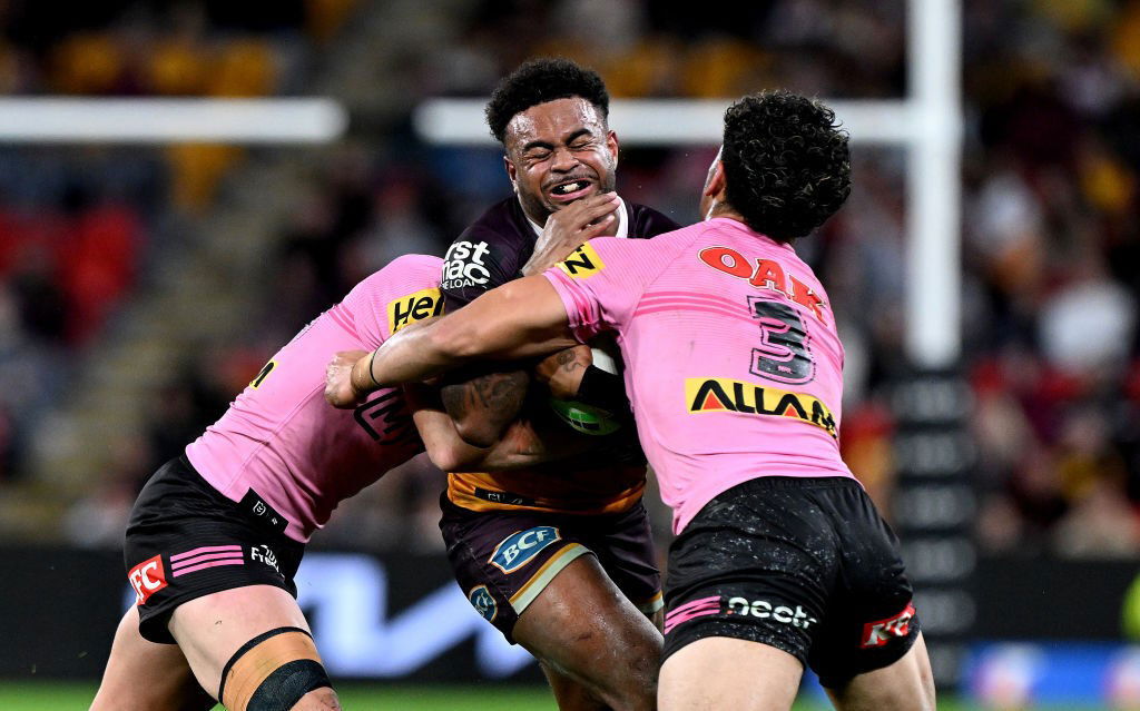 Brisbane Broncos' Ezra Mam is tackled by Penrith Panthers.