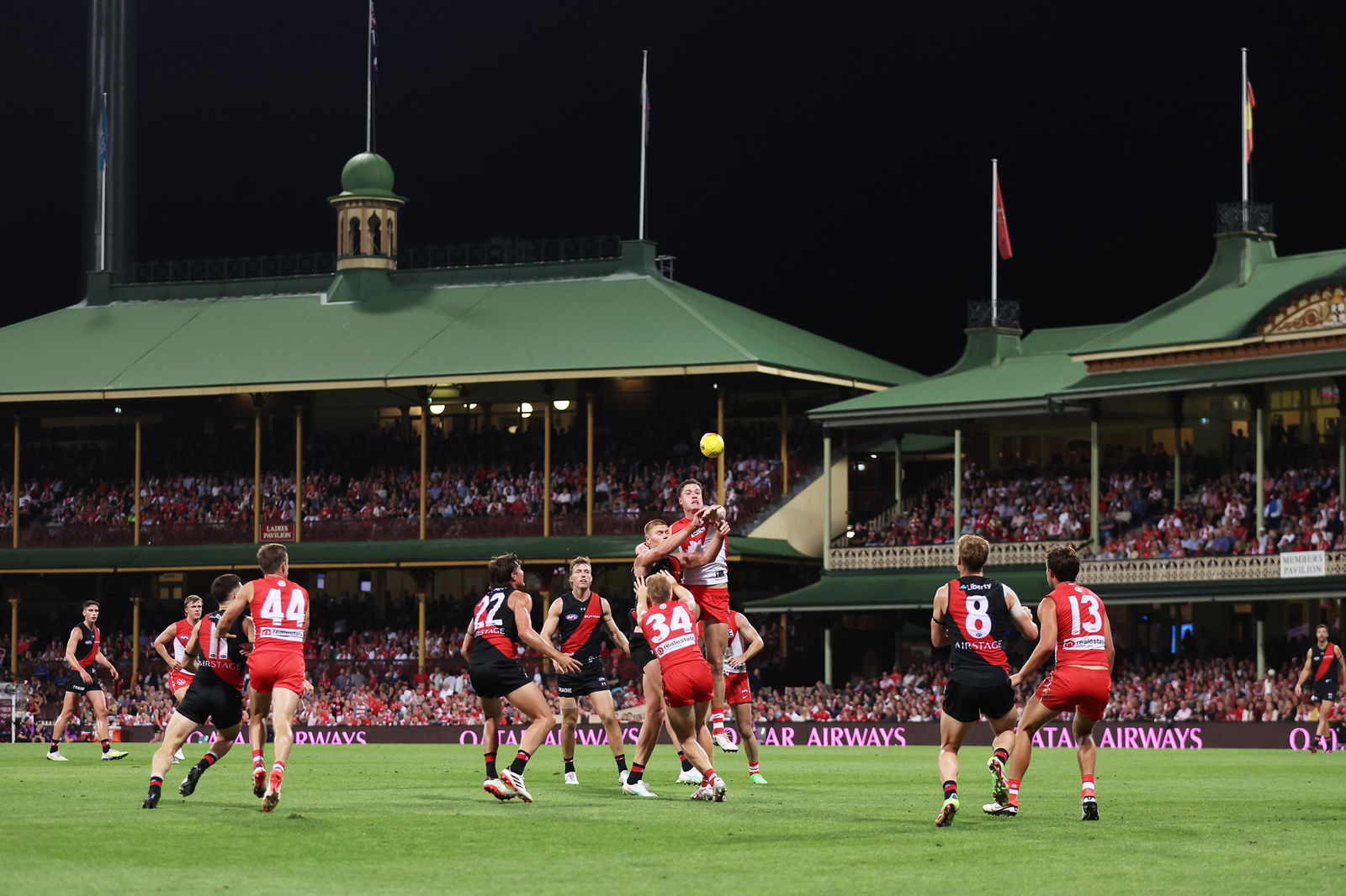 Swans and Bombers players compete