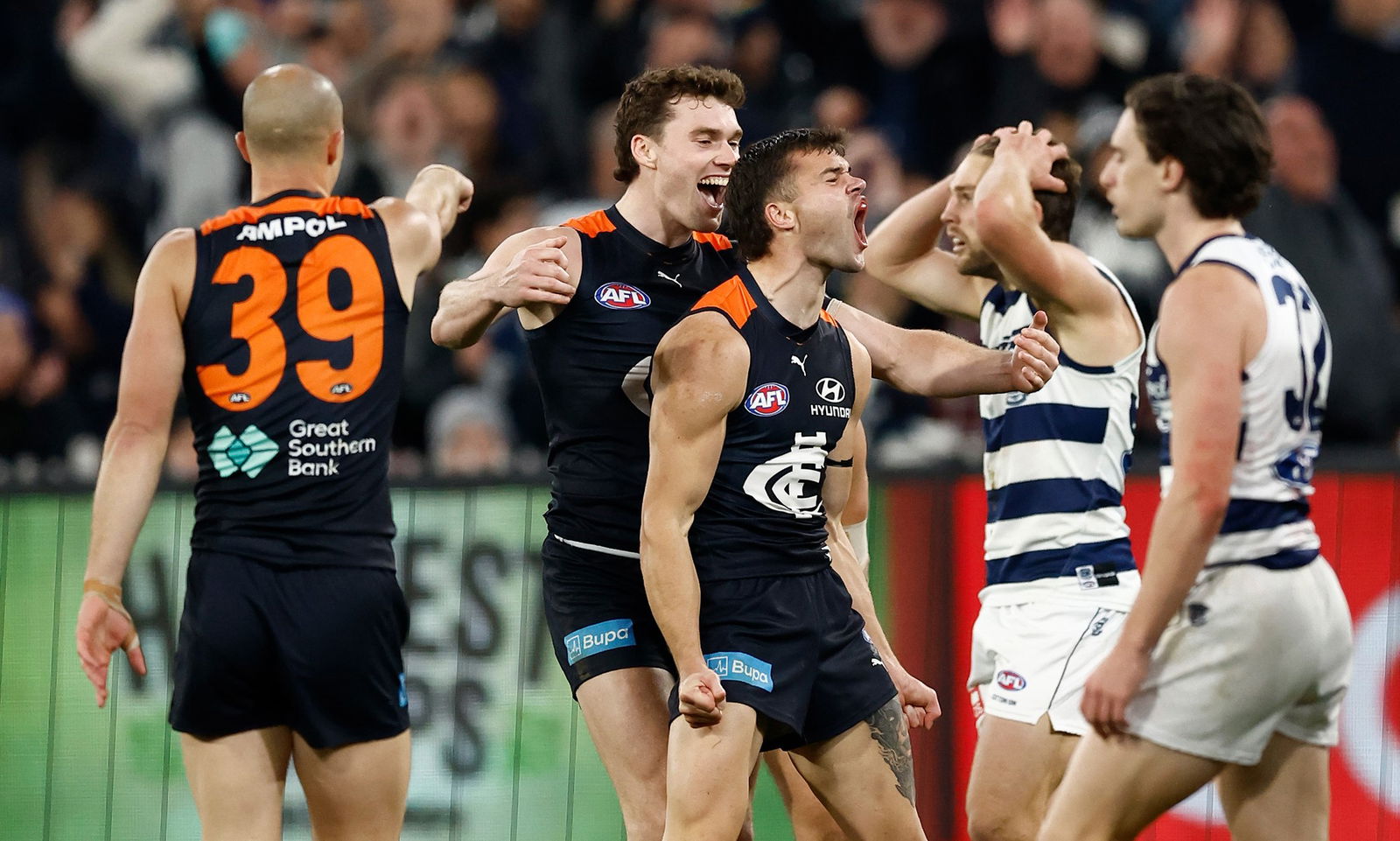 Lachlan Cowan celebrates a goal against Geelong