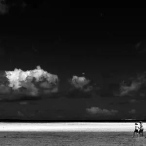 Couple walking shallow water