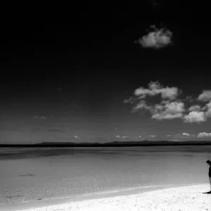 Woman walking beach