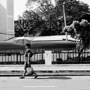 Woman walking with umbrella