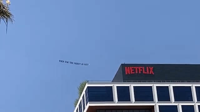 A aeroplane carrying a banner saying 'Renew Star Trek Prodigy! Go Fast!" flying over Netflix's Hollywood HQ