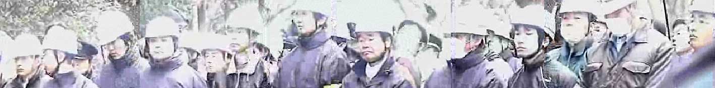 Osaka city workers bowing their heads as homeless workers speak