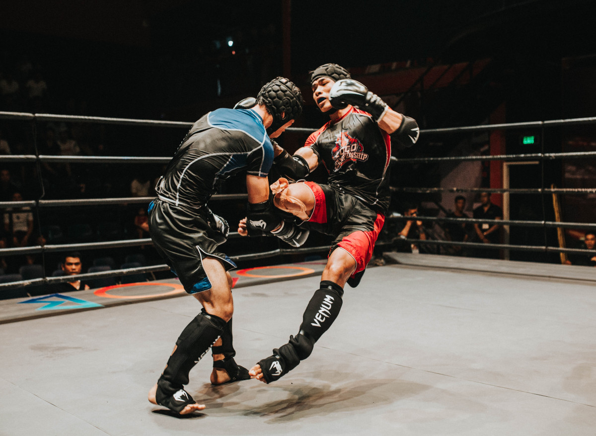 sport venue, contact sport, combat sport, sports, wrestling, individual sports, kickboxing, striking combat sports, boxing ring, sports equipment, boxing, muay thai, pradal serey, strike, kick, mixed martial arts, professional wrestling, competition event, boxing equipment, championship, games, combat