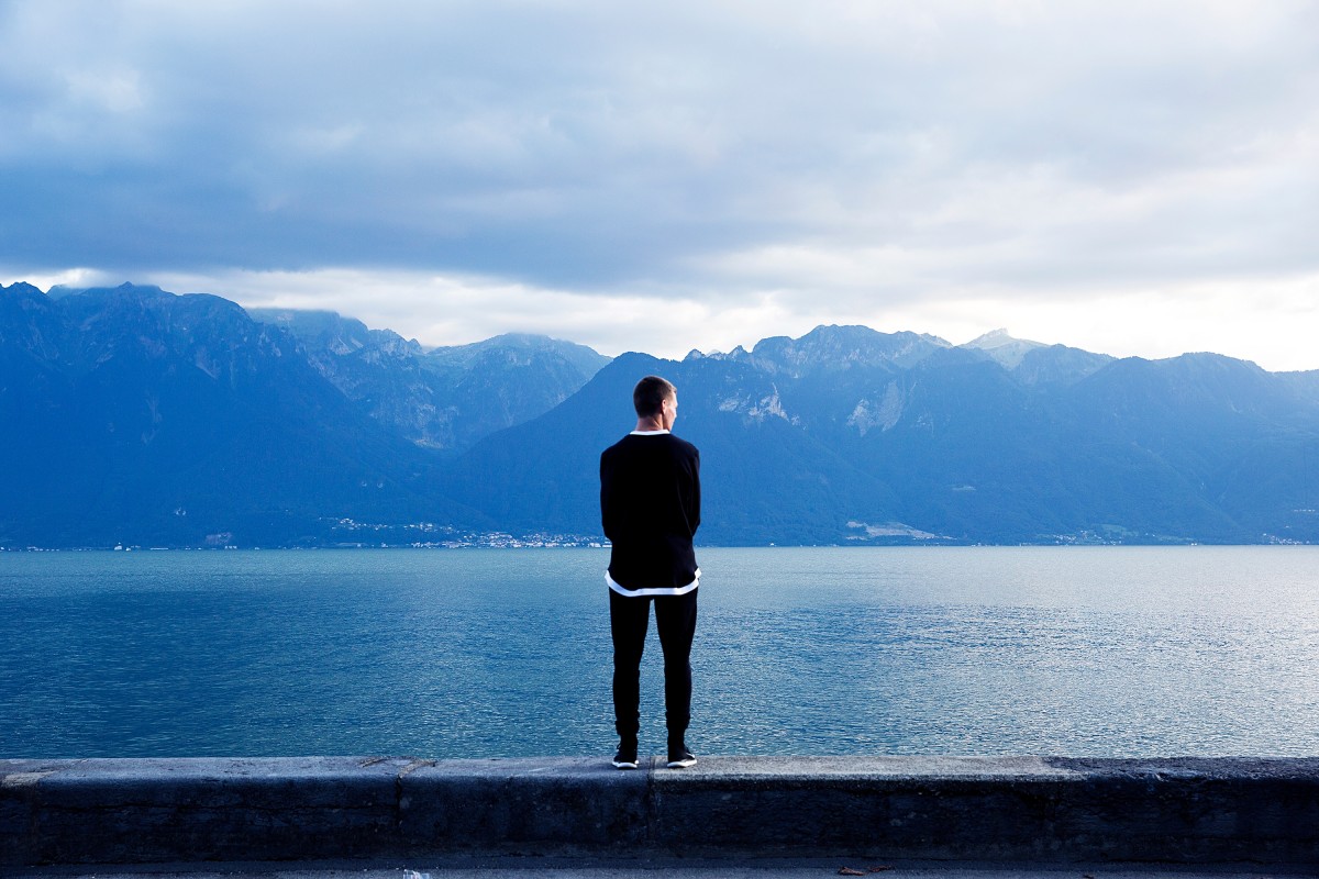 man, sea, coast, water, ocean, horizon, mountain, cloud, morning, lake, vacation, thinking, contemplation, standing, reflection, bay, blue, fjord, loch