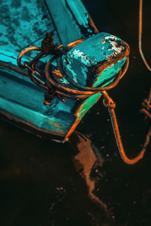 green,water,rope,boat,rust,reflection