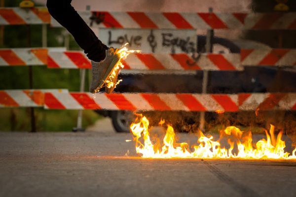 person,shoe,sign,flame,fire