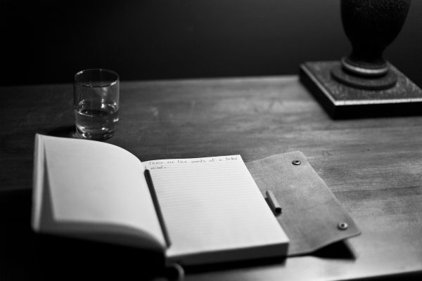 writing,book,photography,table,black and white,pen