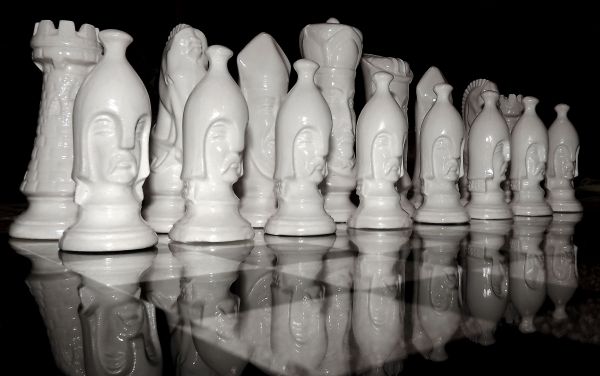 black and white,monochrome,black white,chess,hand,close up