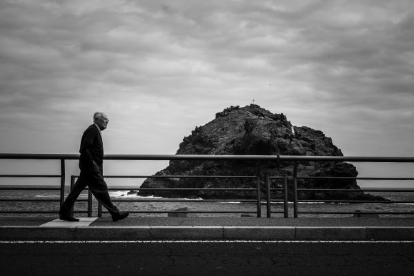 man,sea,coast,ocean,horizon,rock