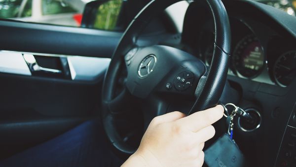 hand,man,car,wheel,interior,driving