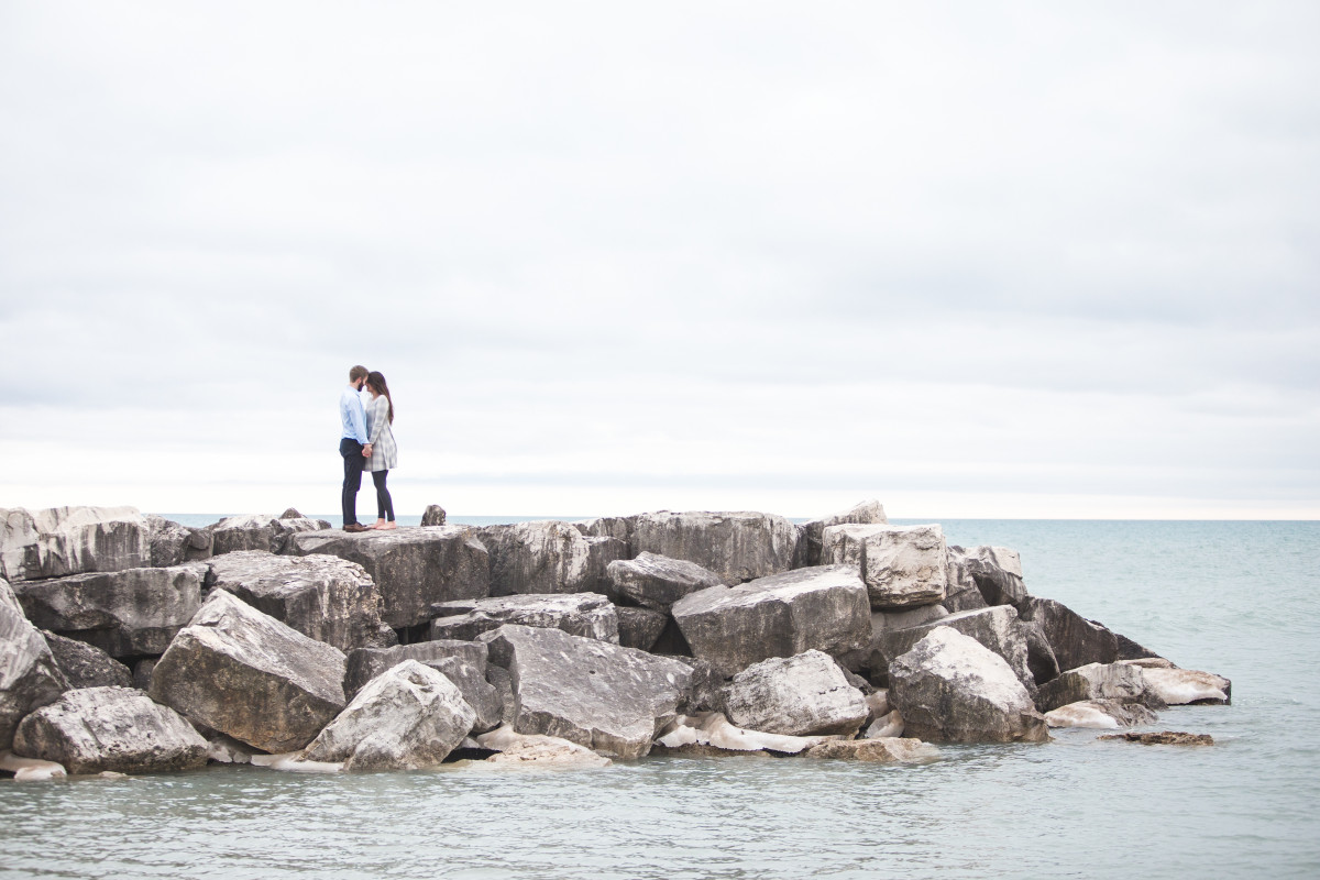 beach, sea, coast, water, sand, rock, ocean, shore, wave, cliff, love, cove, bay, couple, terrain, body of water, breakwater, cape