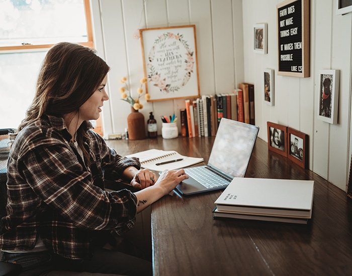 Woman working at desk.