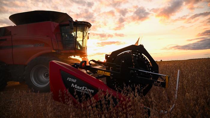 Photo of combine harvesting soybeans.