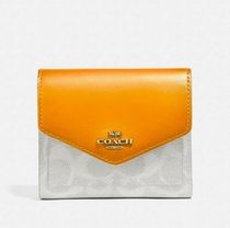 レアCoachカラーブロックシグネチャースモール折りたたみ財布