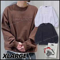 XLARGE フロント エンボス加工ロゴ スウェット ストリートの定番