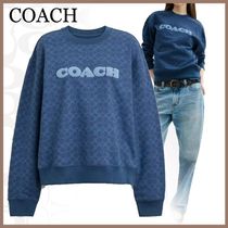 コーデの主役に COACH シグネチャー クルーネックトレーナー