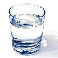 water glass on white background. (drink; clear; clean water; liquid)