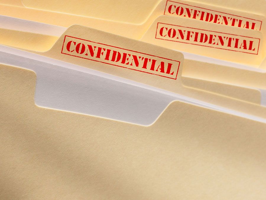 Manila folders marked confidential.