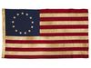 American Colonial Flag, popularly attributed to Betsy Ross, was designed during the American Revolutionary War features 13 stars to represent the original 13 colonies.