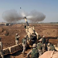 US Marines firing at Fallujah, Iraq, during the Second Battle of Fallujah in November 2004. Operation Iraqi Freedom, Iraq War.