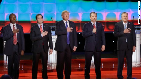 From left, Republican presidential candidates, retired neurosurgeon Ben Carson, Sen. Marco Rubio, R-Fla., businessman Donald Trump, Sen. Ted Cruz, R-Texas, and Ohio Gov. John Kasich listen to the U.S. national anthem before a Republican presidential primary debate at The University of Houston, Thursday, Feb. 25, 2016, in Houston. (AP Photo/David J. Phillip)