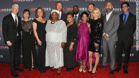 NEW YORK, NY - DECEMBER 17: (L-R) Anderson Cooper, Leslie Morissette, Amy Wright, Rosie Mashale, Andrew Manzi, Mona Patel, Khali Sweeney, Mona Patel, Kelly Ripa, Aaron Valencia, and Samir Lakhani attend CNN Heroes 2017 at the American Museum of Natural History on December 17, 2017 in New York City. 27437_017  (Photo by Michael Loccisano/Getty Images for CNN)