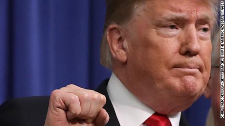 WASHINGTON, DC - DECEMBER 20:  (AFP OUT) U.S. President Donald Trump (L) pumps his fists after signing the the Agriculture Improvement Act during a ceremony with House Agriculture Committee Chairman Mike Conaway (R-TX) (2nd L) and ranking member Rep. Colin Peterson (D-MN) in the South Court Auditorium of the Eisenhower Executive Office Building December 20, 2018 in Washington, DC. Designed to go through the 2023 crop year, this farm bill is the first since 1990 that was enacted within the year for which programs were authorized. (Photo by Chip Somodevilla/Getty Images)