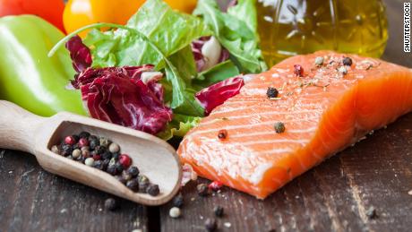 fresh salmon with vegetables on a wooden table; Shutterstock ID 324500189; Job: -