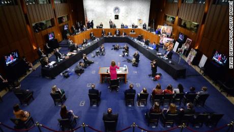 WASHINGTON, DC - OCTOBER 12: Supreme Court Justice nominee Judge Amy Coney Barrett is sworn in during the Senate Judiciary Committee confirmation hearing for Supreme Court Justice on Capitol Hill on October 12, 2020 in Washington, DC. With less than a month until the presidential election, President Donald Trump tapped Amy Coney Barrett to be his third Supreme Court nominee in just four years. If confirmed, Barrett would replace the late Associate Justice Ruth Bader Ginsburg. (Photo by Kevin Dietsch - Pool/Getty Images)