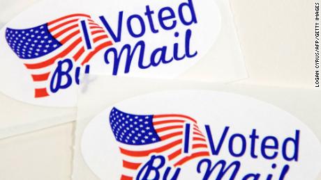 TOPSHOT - Stickers that read &quot;I Voted By Mail&quot; sit on a table waiting to be stuffed into envelopes by absentee ballot election workers  at the Mecklenburg County Board of Elections office in Charlotte, NC on September 4, 2020. - The US election is officially open: North Carolina on September 4, 2020 launched vote-by-mail operations for the November 3 contest between President Donald Trump and Joe Biden, which is getting uglier by the day.
Worries about the unabated spread of the coronavirus are expected to prompt a major increase in the number of ballots cast by mail, as Americans avoid polling stations. (Photo by Logan Cyrus / AFP) (Photo by LOGAN CYRUS/AFP via Getty Images)