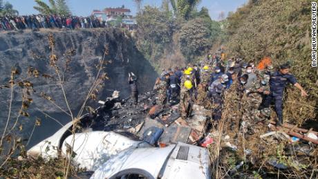 Rescue teams work to retrieve bodies at the crash site of an aircraft carrying 72 people in Pokhara in western Nepal January 15, 2023. Bijay Neupane/Handout via REUTERS THIS IMAGE HAS BEEN SUPPLIED BY A THIRD PARTY. MANDATORY CREDIT. NO RESALES. NO ARCHIVES.