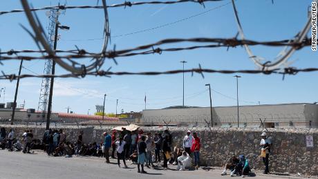 Immigrants queue outside a U.S. Customs and Border Protection (CPB) office to be processed near the border with Mexico as the United States prepares to lift COVID-19 era Title 42 restrictions that have blocked migrants at the U.S.-Mexico border from seeking asylum since 2020 near El Paso, Texas, U.S., May 9, 2023.